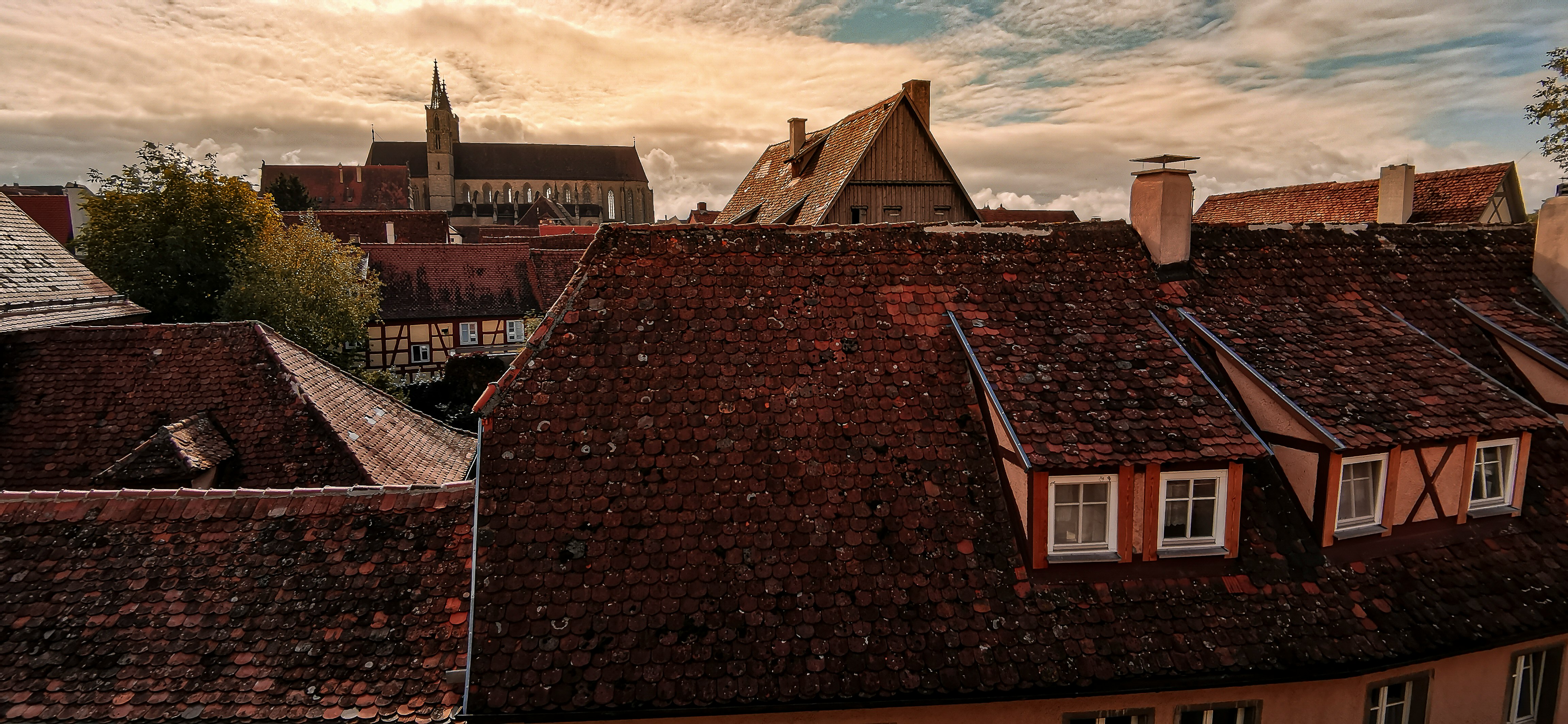 brown brick building under cloudy sky during daytime